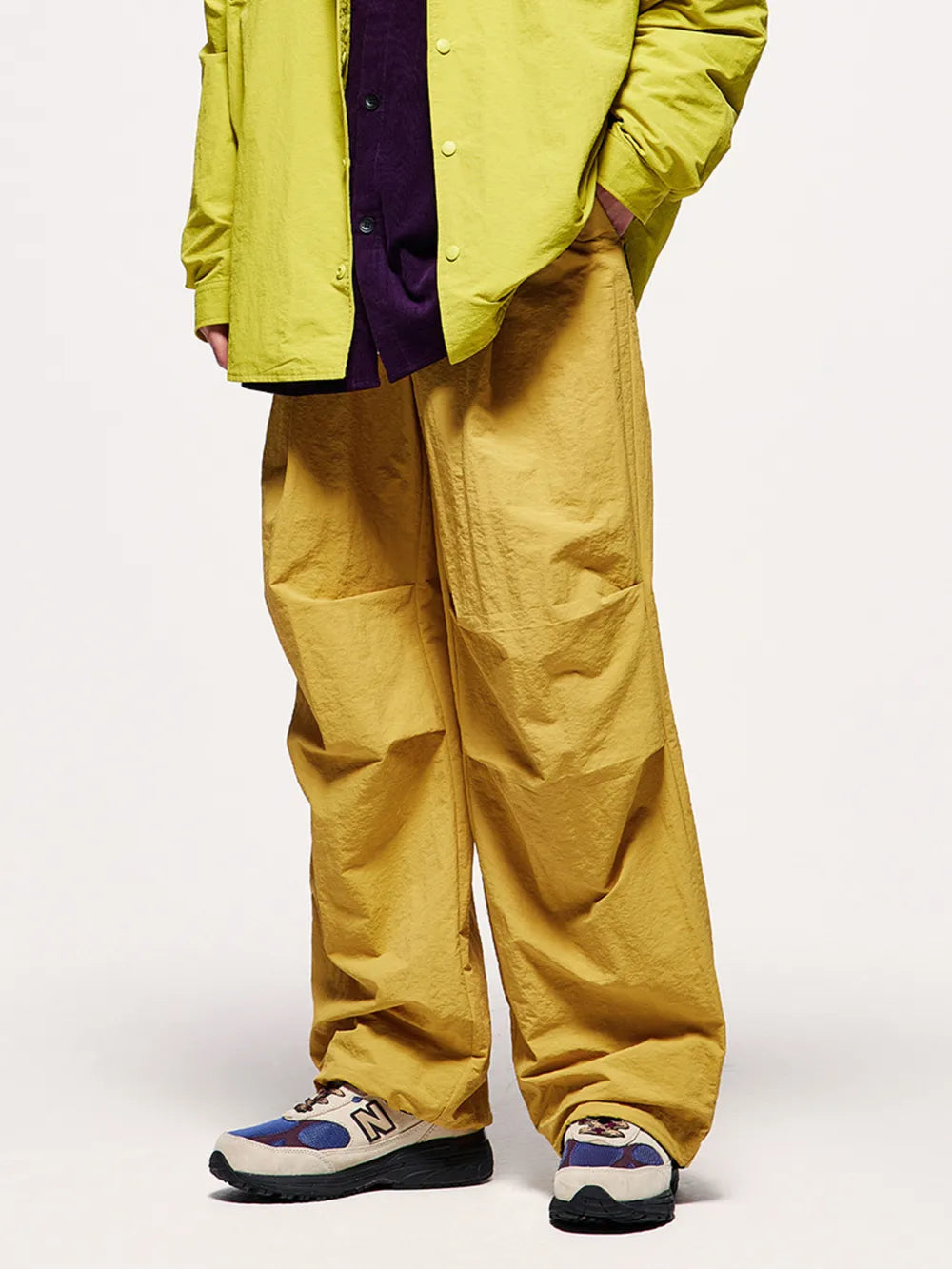 Men's ginger yellow cargo jogger pants with drawstring waist and relaxed fit.