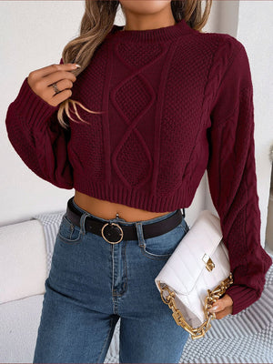 Wine cable knit cropped mock neck sweater with diamond pattern detail.