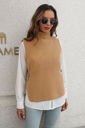 Khaki ribbed knit turtleneck vest with side buttons, worn over a white shirt.