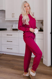Plush lounge set in Deep Rose, featuring relaxed fit joggers with a drawstring waist and cuffed ankles.