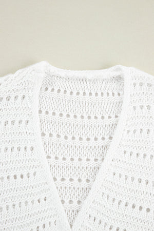 White open-knit dolman sleeve cardigan with a V-neck and breathable acrylic fabric.