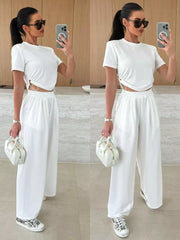 White crop top with drawstring sides and wide-leg pants set.