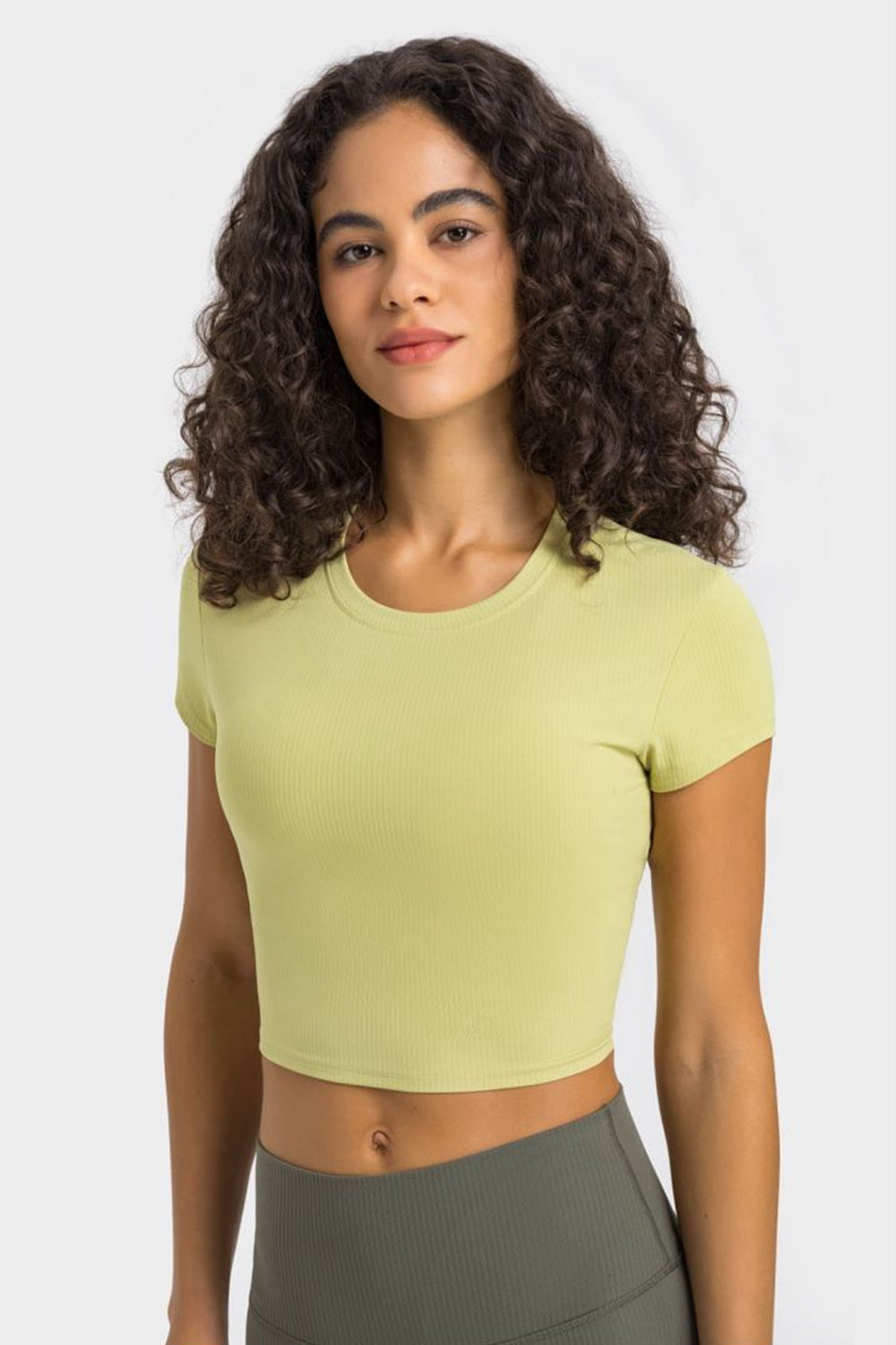 Ribbed crewneck crop top in lemon with short sleeves.