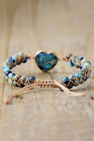 Braided bracelet with blue marbled heart stone and assorted blue and tan beads