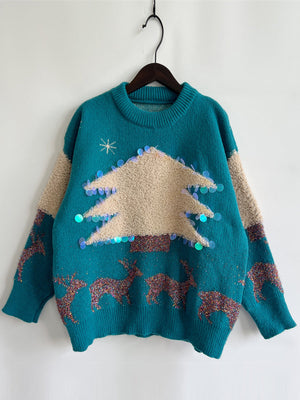 Teal acrylic sweater with sequin-trimmed Christmas tree and reindeer pattern.