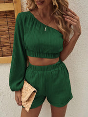 Textured one-shoulder crop top and shorts set in Matcha Green with elastic waistband and cuffs.