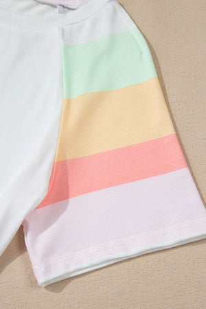 White loungewear top with pastel rainbow striped sleeves and hem.