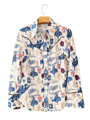 Maternity long sleeve shirt in Milky White with rodeo print, button-down front, and black piping.