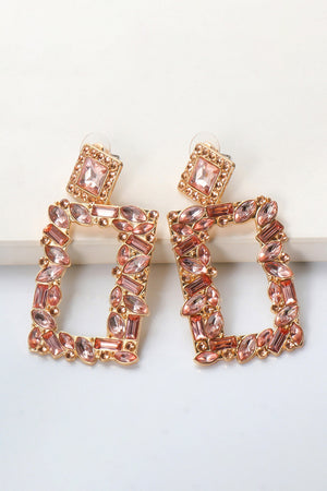 Geometric jewel box earrings with pink rhinestones and gold alloy setting.