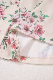 Floral print peplum blouse with square neck, showing hem detail
