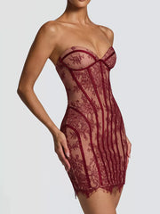 Burgundy lace overlay strapless mini dress with corset detailing and a bodycon fit.
