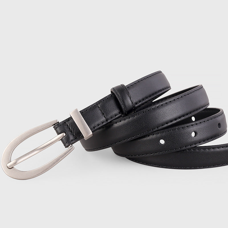 Black cowhide leather skinny belt with silver buckle and adjustable fit.