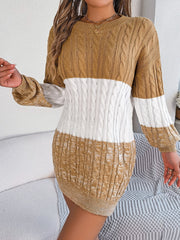 Colorblock cable knit mini dress in camel, white, and camel with crew neck and long sleeves.