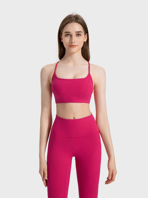 Fuchsia pink active crop top with thin straps and square neckline.