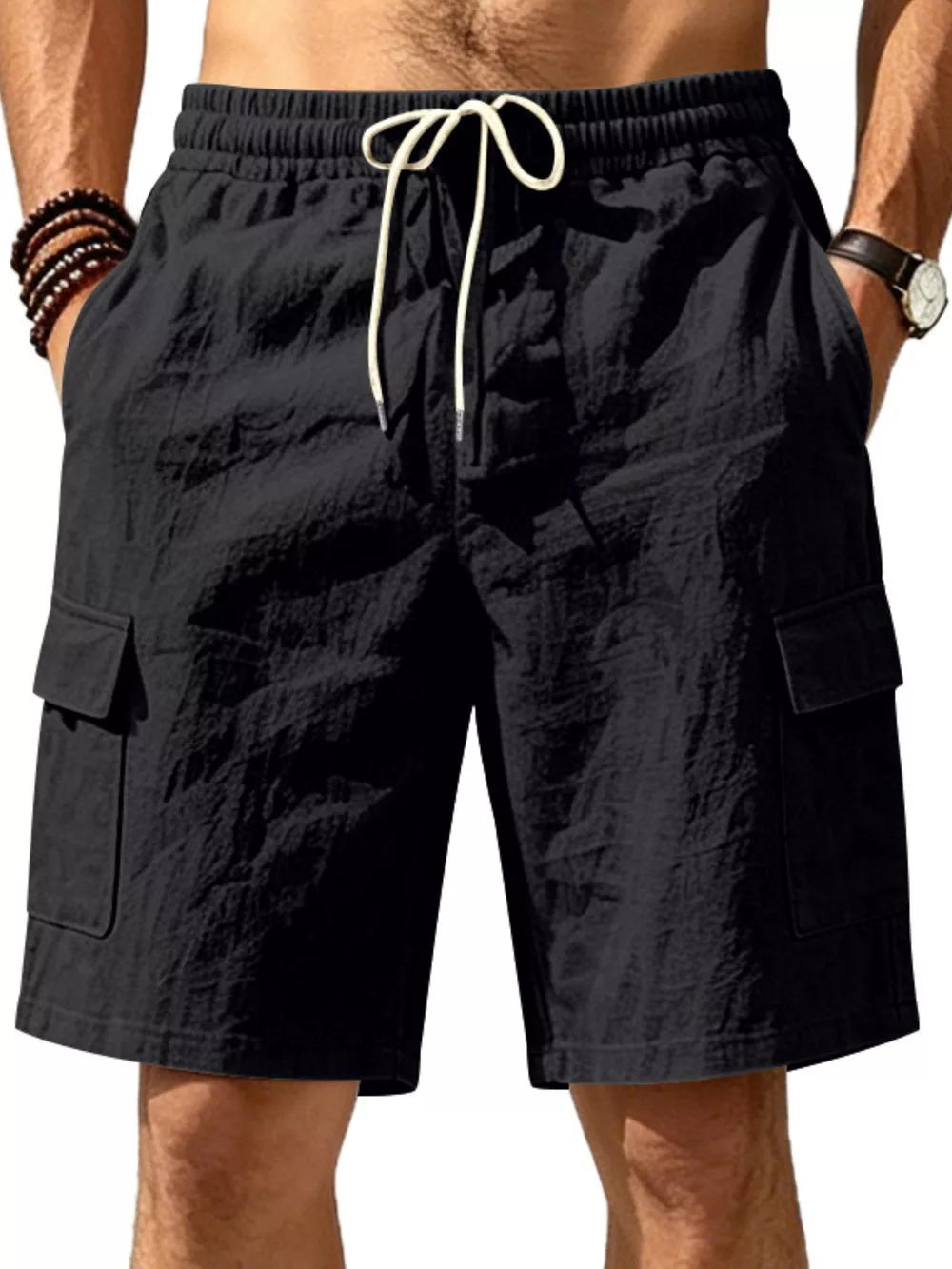 Black cargo shorts with drawstring waist and crinkled texture.