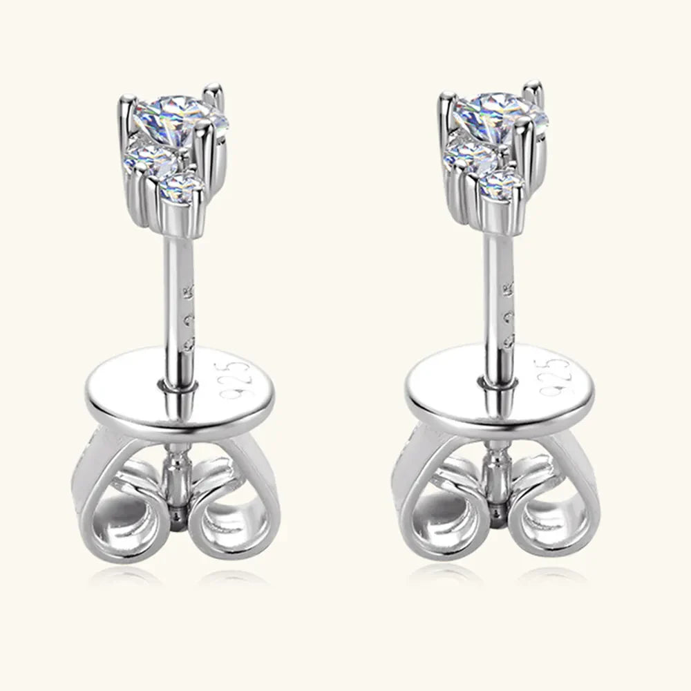 Silver celestial cluster diamond stud earrings with butterfly backs.