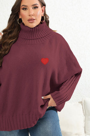 Wine turtleneck sweater with red heart appliqué and batwing sleeves.