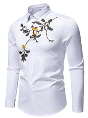 White cotton button-down shirt with embroidered floral branch detail on chest.