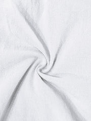 White cargo sweatpants with drawstring detail, showing textured fabric.