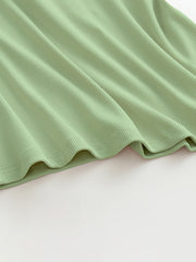 Ribbed halter tank top in Gum Leaf green with built-in bra detail.