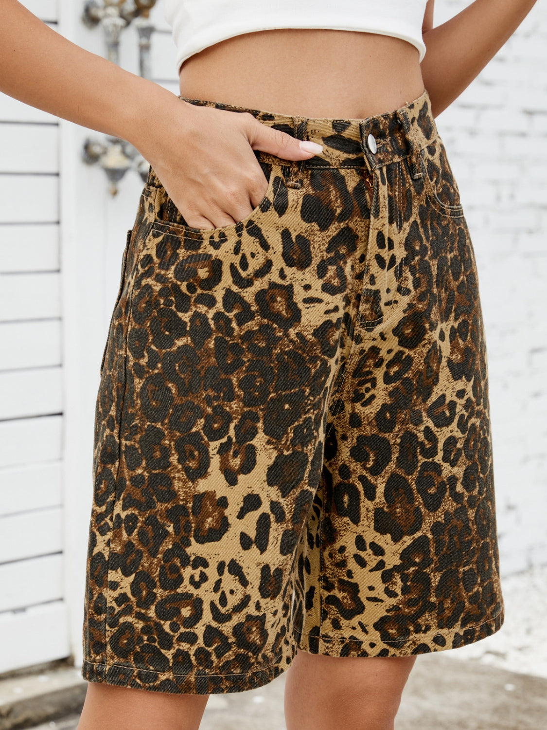 Leopard print denim bermuda shorts with a comfortable, casual fit.