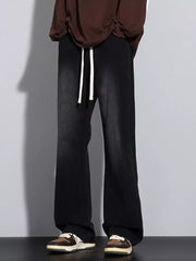 Men's black vintage wash jeans with drawstring and wide leg