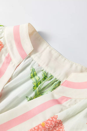 Vibrant floral print cotton blouse with pink stripes and notched neckline.