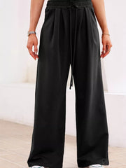 Black cotton maternity pants with drawstring high waist and pleats