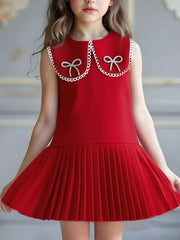 Red toddler dress with lace collar, two bows, and pleated skirt.