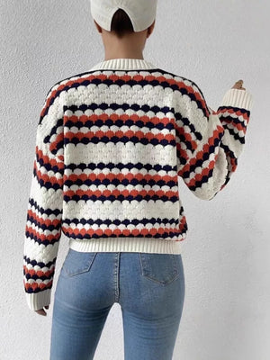 Textured striped knit sweater with bubble knit detail in white, orange, and navy.