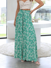 Green palazzo trousers with white floral print and ruffled waist