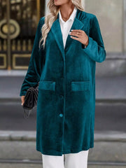 Deep Teal velvet longline trench coat with lapel collar and buttoned front.
