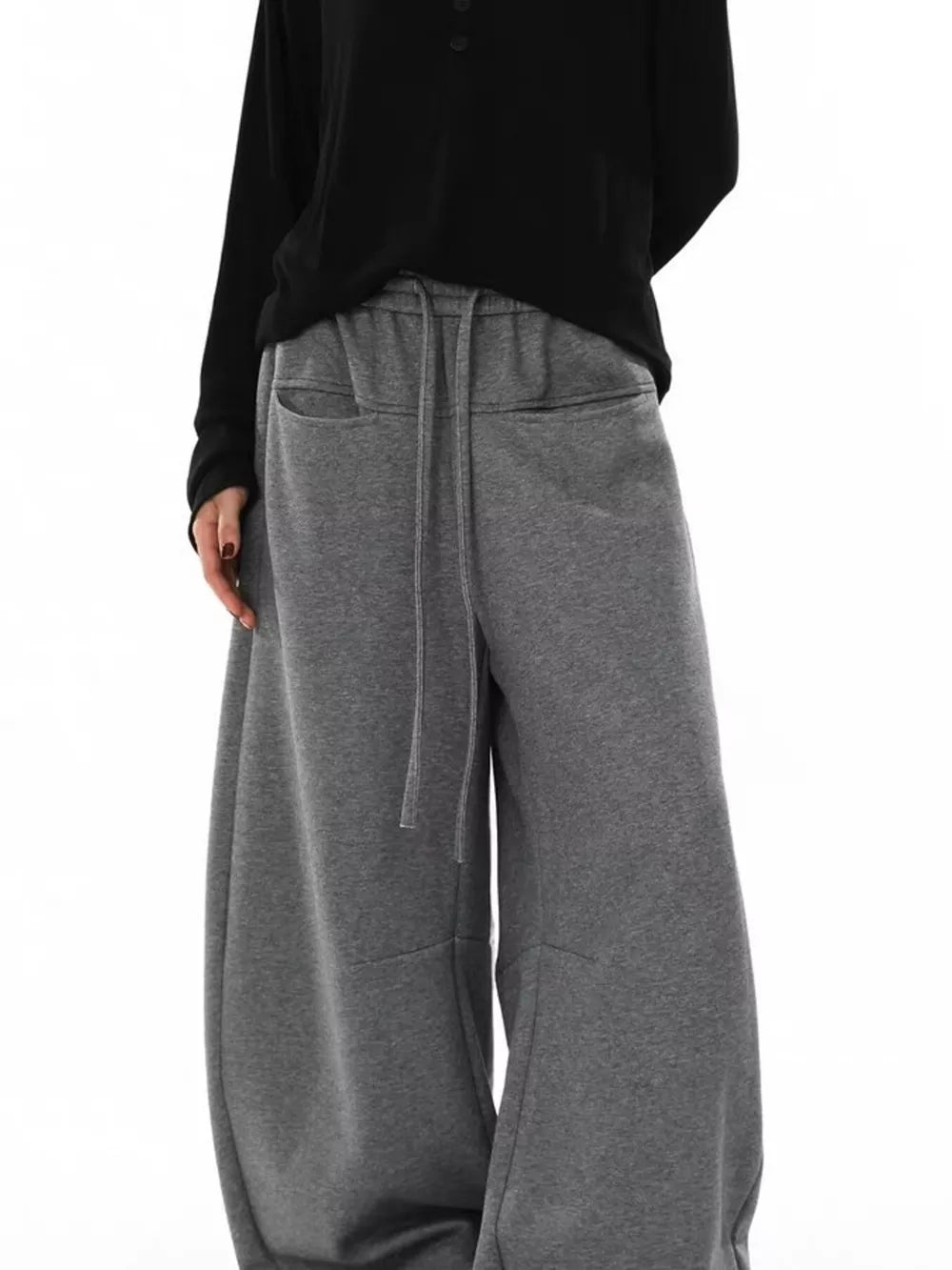 Gray wide-leg sweatpants with drawstring and pockets.