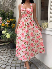 Romantic floral halter midi dress with a-line cut and bow detail.
