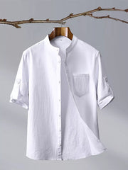 White cotton blend short sleeve shirt with mandarin collar and chest pocket.