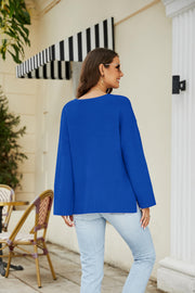 Relaxed fit royal blue V-neck knit pullover sweater with long sleeves.