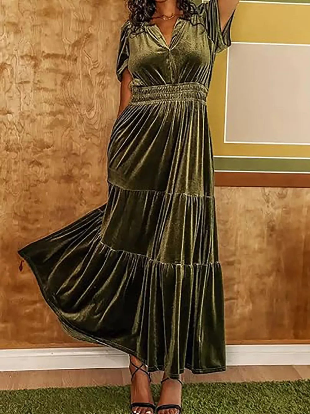 Army green velvet maxi dress with ruched bodice and tiered skirt.