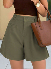 Army green high-waisted pleated shorts with button closure and pockets.