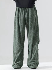 Men's sage green vintage wide leg sweatpants with drawstring and marble pattern.