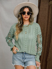 Light green acrylic openwork sleeve knit sweater with a round neckline.