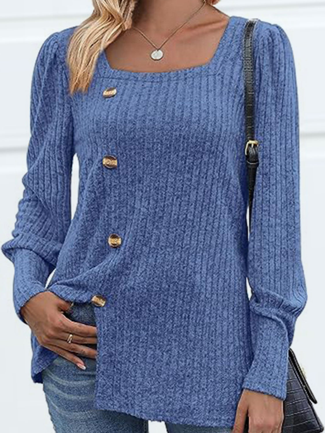 Dusty blue ribbed knit blouse with puff sleeves and gold buttons, square neckline