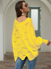 Yellow knit sweater with boat neck, scalloped detail, and balloon sleeves.