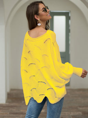 Yellow knit sweater with boat neck, scalloped detail, and balloon sleeves.