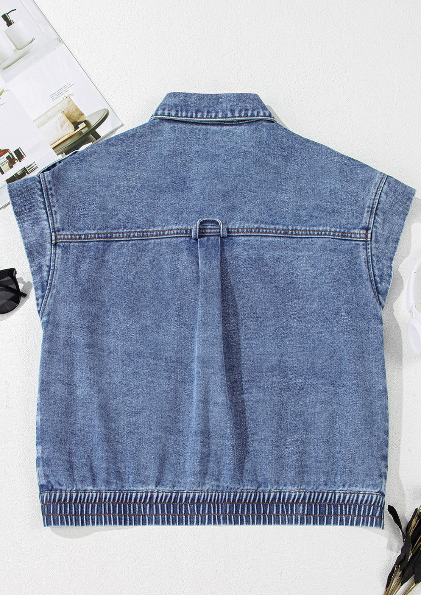 Boxy medium wash denim vest with shoulder detail and elasticized hem
