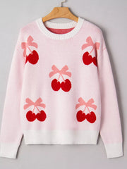 Pink knit sweater with all-over red cherry and pink bow appliqué pattern.