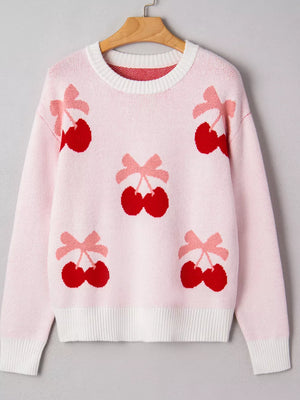 Pink knit sweater with all-over red cherry and pink bow appliqué pattern.