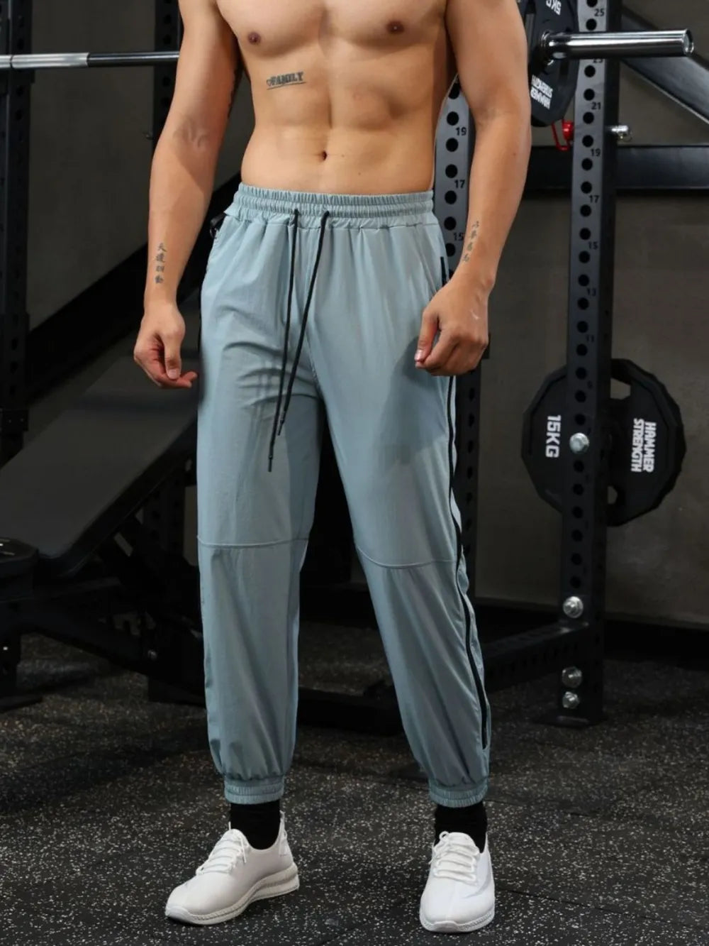 Air Force Blue track pants with drawstring waist and zip detail on side seam