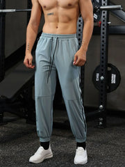 Air Force Blue track pants with drawstring waist and zip detail on side seam
