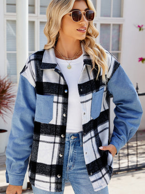 Colorblock plaid denim shacket in dusty blue with button front and chest pockets.