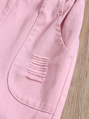 Pink distressed denim overalls for baby girls with frayed pocket detail.